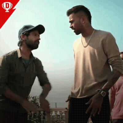 Two Men Standing Next To Each Other GIF