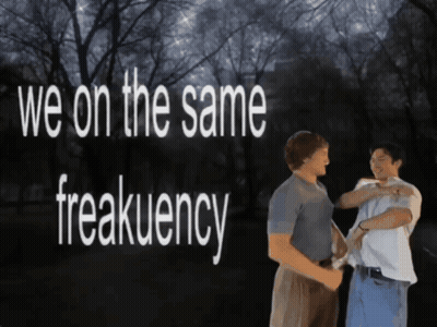 Two Men Standing Next To Each Other GIF