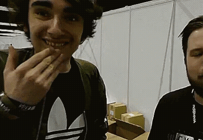 Two Men Standing Next To Each Other GIF