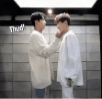 Two Men Standing Next To Each Other GIF