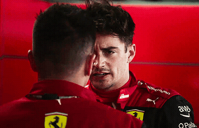 Two Men Standing Next To Each Other GIF