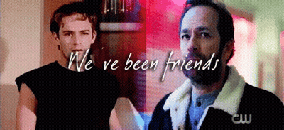 Two Men Standing Next To Each Other GIF