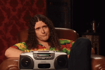 Two Men Standing Next To Each Other GIF