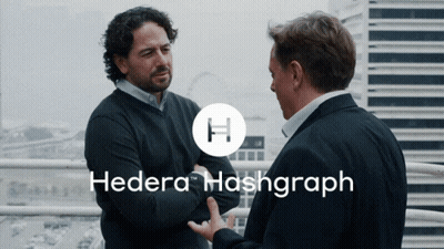 Two Men Standing Next To Each Other Hedera Hashgraph GIF