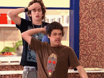 Two Men Standing Next To Each Other GIF