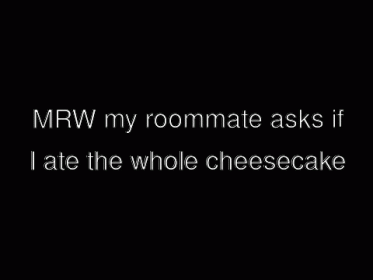 Two Men Standing Next To Each Other In A Dark Room GIF
