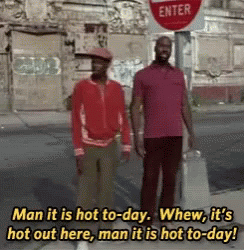 Two Men Standing Next To Each Other In Front Of A Stop Sign That Says Enter GIF