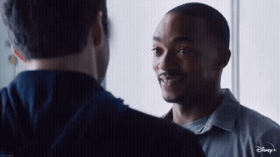 Two Men Standing Next To Each Other GIF