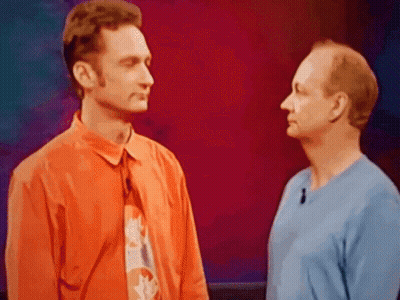 Two Men Standing Next To Each Other GIF