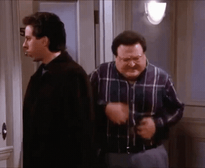 Two Men Standing Next To Each Other, One In Plaid Shirt GIF