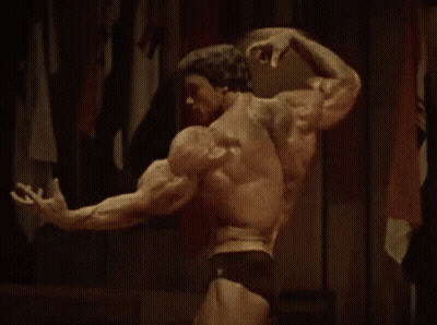 Two Men Standing Next To Each Other One In Red Shirt GIF