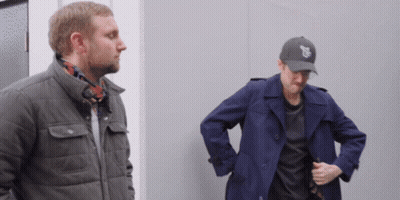 Two Men Standing Next To Each Other One Wearing Chicago Hat GIF