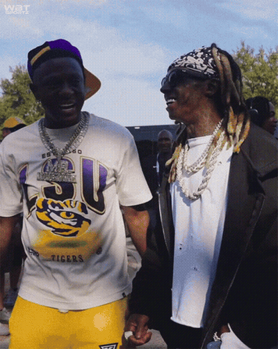 Two Men Standing Next To Each Other One Wearing Tigers Shirt GIF