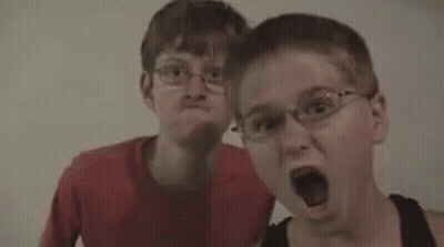 Two Men Standing Next To Each Other Popcorn GIF