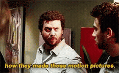 Two Men Standing Next To Each Other Saying How They Made Those Motion Pictures GIF