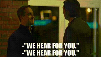 Two Men Standing Next To Each Other Saying We Hear For You GIF