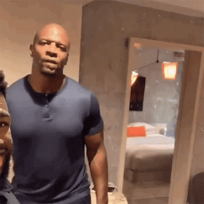 Two Men Standing Next To Each Other GIF
