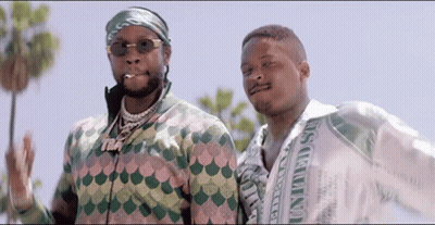 Two Men Standing Next To Each Other GIF