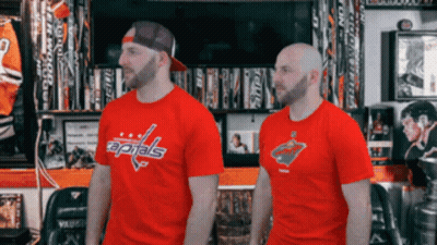 Two Men Standing Next To Each Other Wearing Red Capitals T-Shirts GIF
