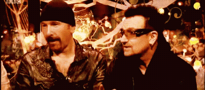Two Men Standing Next To Each Other With A Bbc Logo On The Bottom Right GIF