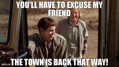 Two Men Standing Next To Each Other With A Caption That Says You Ll Have To Excuse My Friend The Town Is Back That Way ! GIF