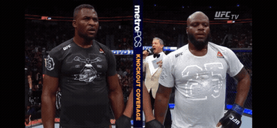 Two Men Standing Next To Each Other With A Metropcs Banner In The Background GIF