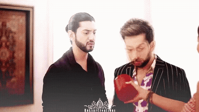 Two Men Standing Next To Each Other With A Watermark That Says ' Ruban Creations ' On The Bottom GIF