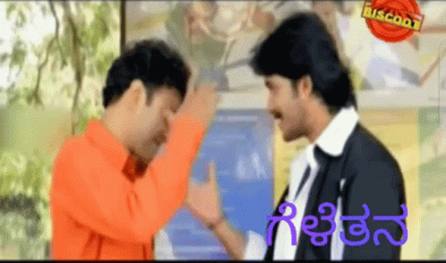 Two Men Standing Next To Each Other With Biscoot GIF