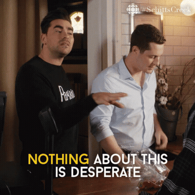 Two Men Standing Next To Each Other With Nothing About This Is Desperate Written In Yellow GIF