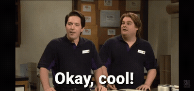 Two Men Standing Next To Each Other With Okay Cool Written On The Screen GIF