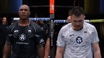 Two Men Standing Next To Each Other With One Wearing A Shirt That Says Ufc GIF
