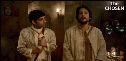 Two Men Standing Next To Each Other With The Chosen GIF