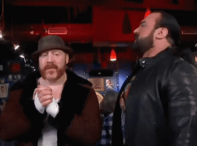 Two Men Standing Next To Each Other With The Word Banger On The Bottom Right GIF