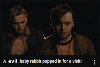 Two Men Standing Next To Each Other With The Words A Evil Baby Rabbit Popped In For A Visit On The Bottom GIF