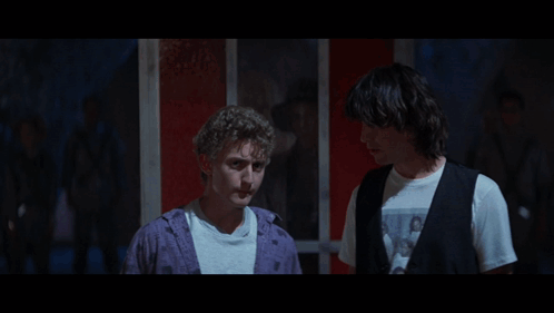 Two Men Standing Next To Each Other With The Words Be Excellent To Each Other GIF
