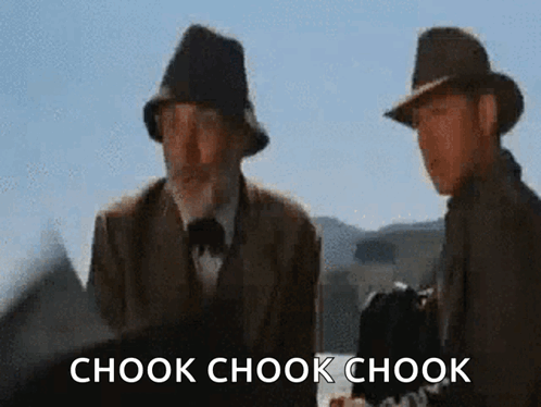 Two Men Standing Next To Each Other With The Words Chook Chook Chook Written On The Bottom GIF