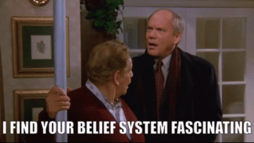 Two Men Standing Next To Each Other With The Words " I Find Your Belief System Fascinating " Below Them GIF