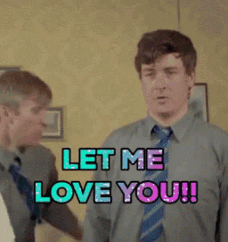 Two Men Standing Next To Each Other With The Words Let Me Love You GIF