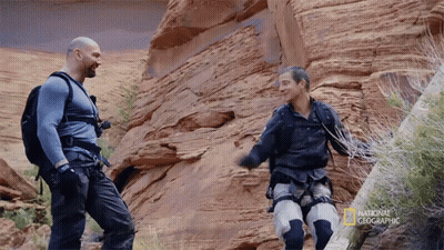 Two Men Standing Next To Each Other With The Words National Geographic On The Bottom GIF