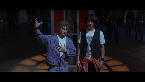 Two Men Standing Next To Each Other With The Words Party On Dudes Written Below Them GIF