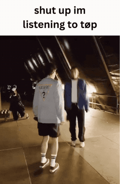 Two Men Standing Next To Each Other With The Words Shut Up Im Listening To Top At The Top GIF