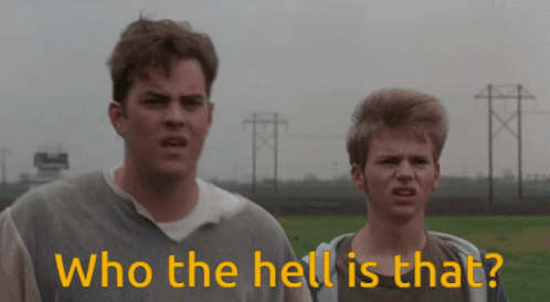 Two Men Standing Next To Each Other With The Words " Who The Hell Is That " In Yellow GIF