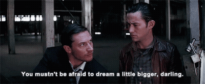 Two Men Standing Next To Each Other With The Words " You Mustn 'T Be Afraid To Dream A Little Bigger Darling " GIF