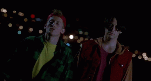 Two Men Standing Next To Each Other With Their Arms Crossed And Wearing Sunglasses GIF