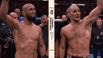 Two Men Standing Next To Each Other With UFC GIF