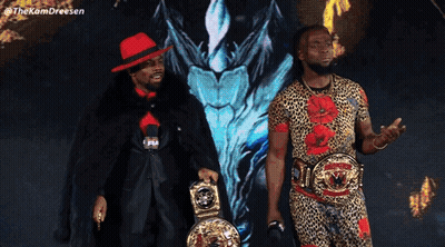 Two Men Standing Next To Each Other GIF