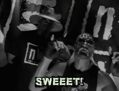 Two Men Standing Next To Sweet Banner GIF