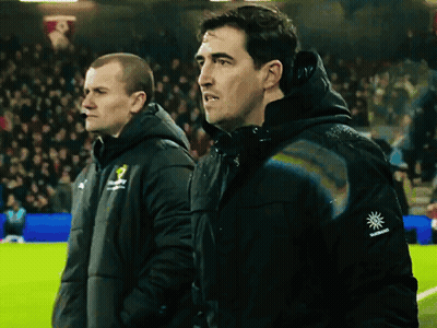 Two Men Standing On A Soccer Field One Of Whom Has A Sun On His Sleeve GIF