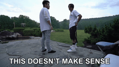 Two Men Standing On A Stone Patio With The Words This Does N't Make Sense GIF
