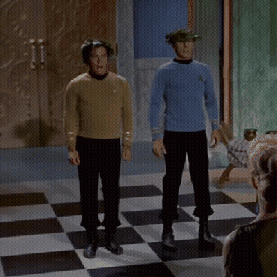 Two Men Standing On Checkered Floor GIF